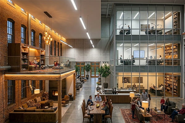An open-plan living space showing zoned lighting